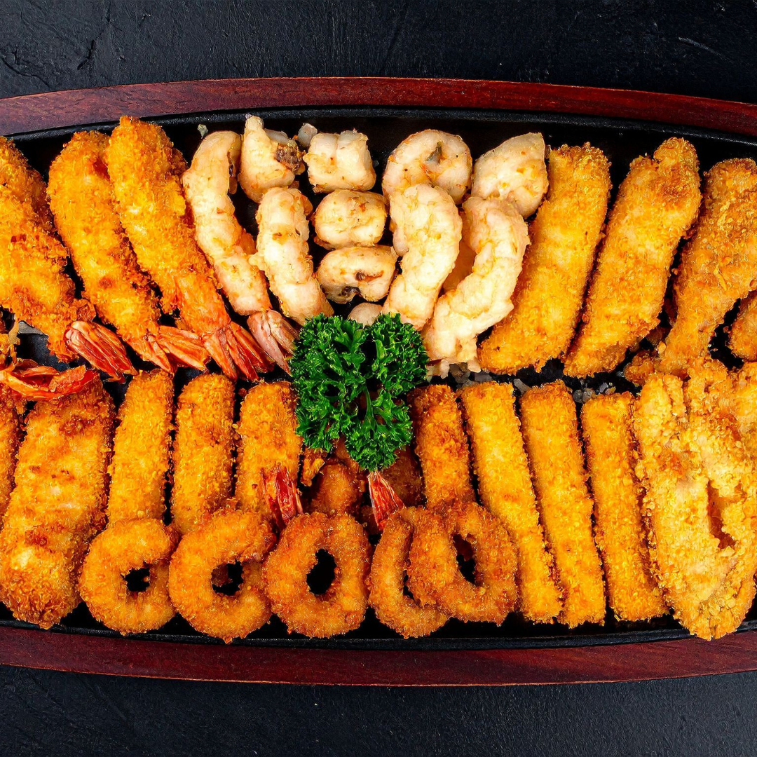 A platter of assorted vegetable and shrimp tempura.
