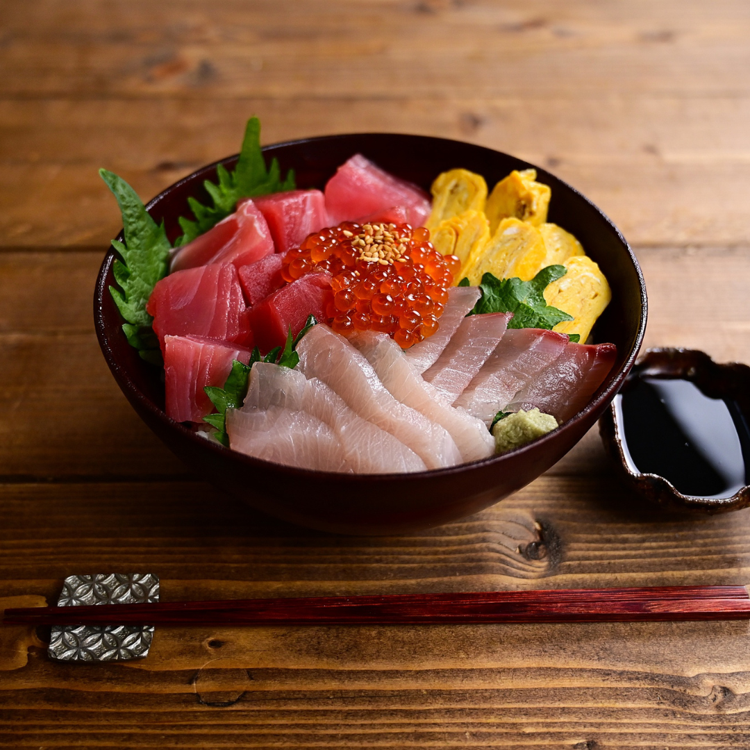 Close-up of fresh, colorful sashimi, the star of any Chirashi bowl.