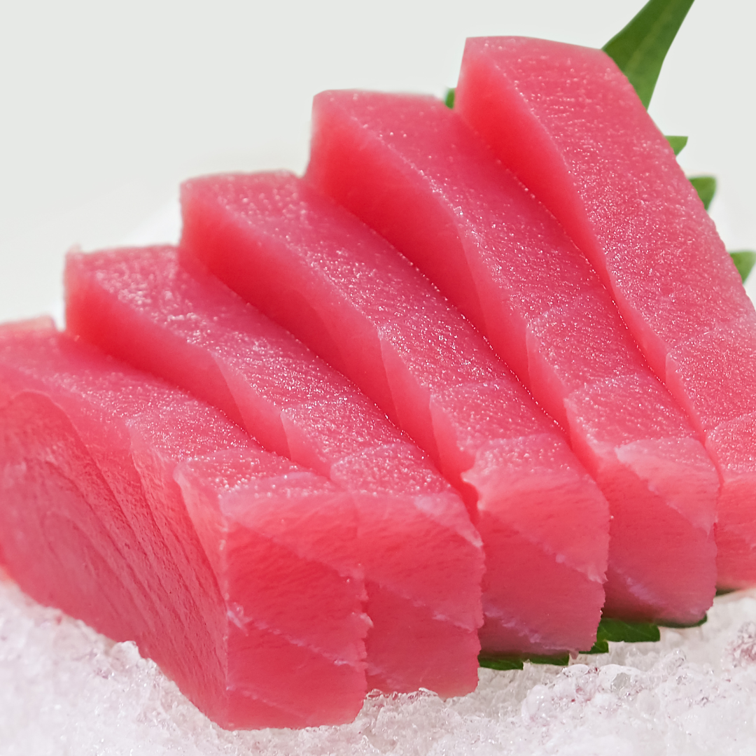 Close-up of fresh salmon and tuna sashimi slices.