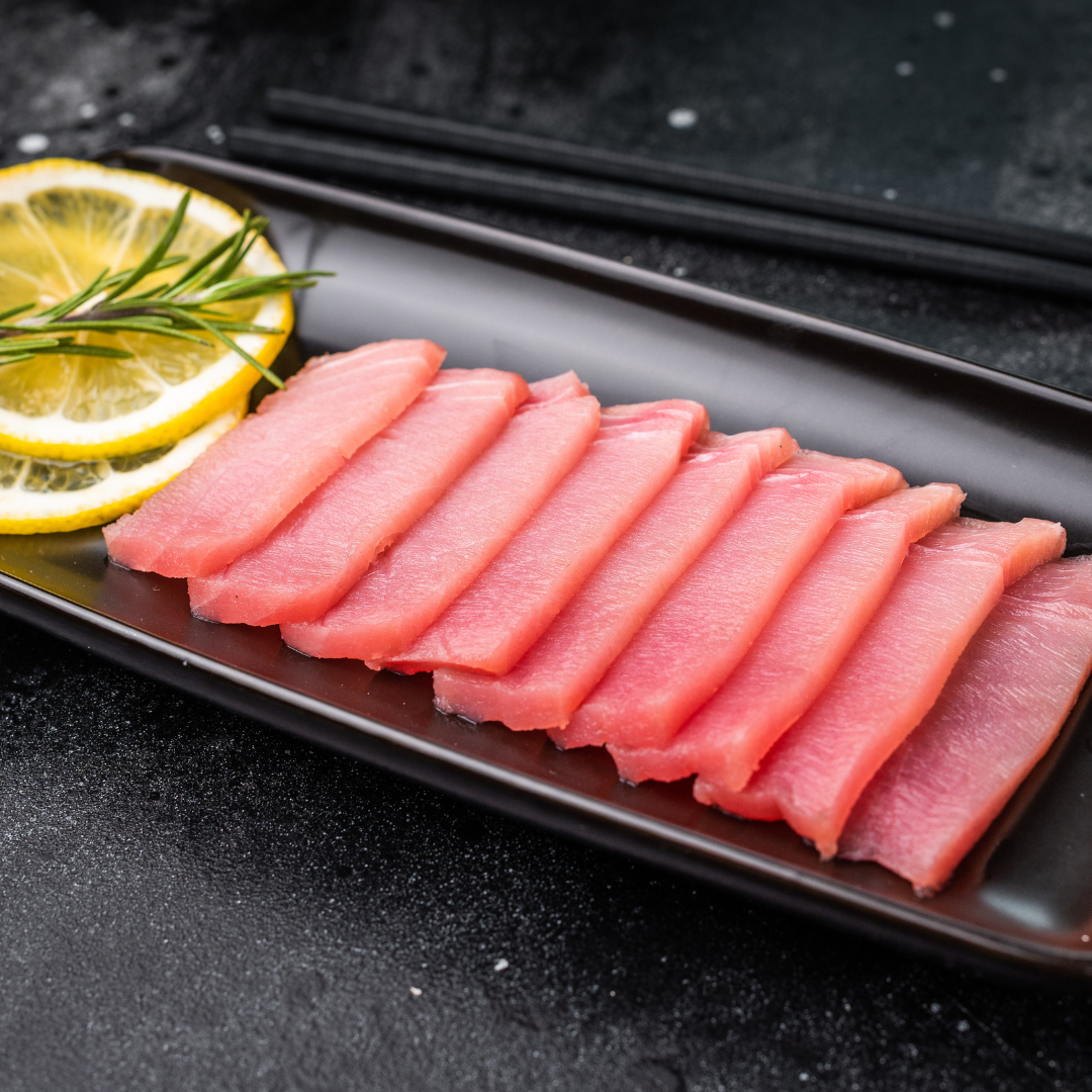 Expertly sliced fresh sashimi, showcasing chef's skill and fish quality.