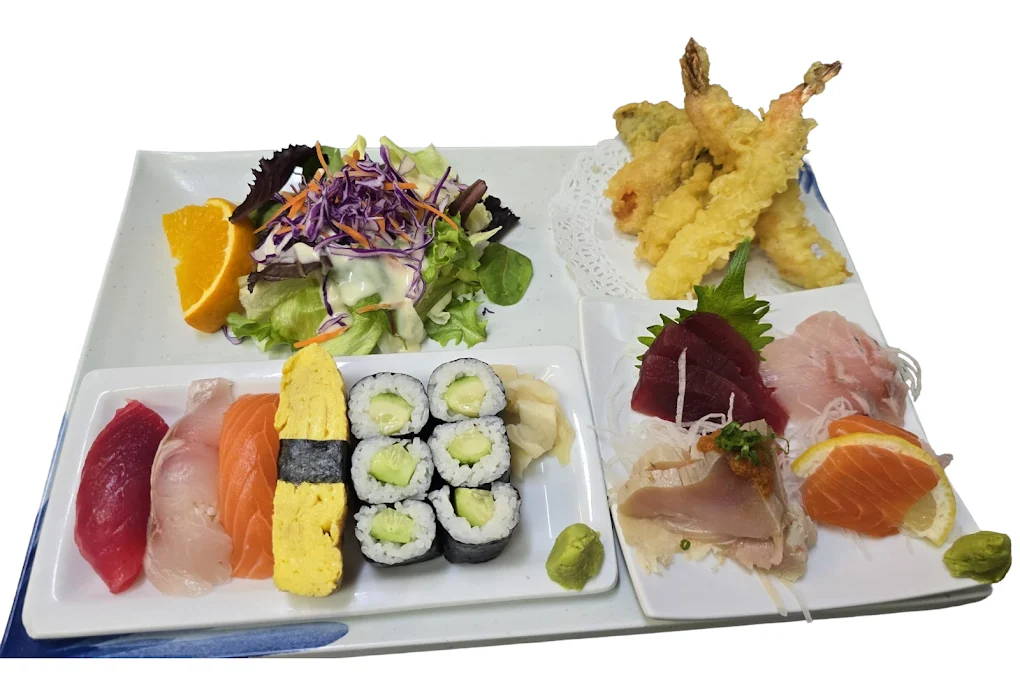 A spread of Japanese appetizers, including grilled fish and edamame.